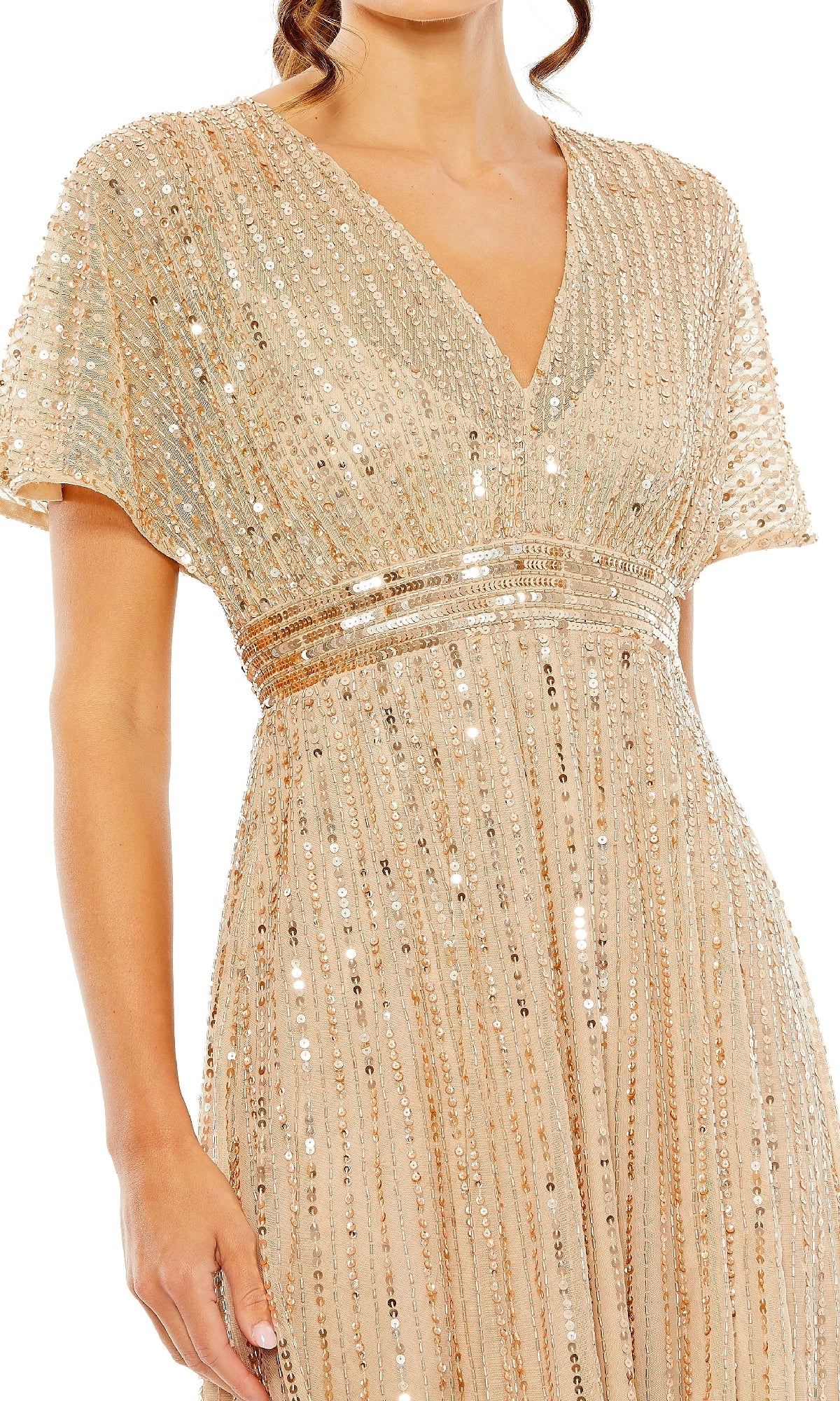 A woman in the Mac Duggal 14007 Short Sequin Wedding-Guest Dress—light gold, short-sleeve, V-neck with vertical sequins and beading—makes an elegant statement at any semi-formal event.